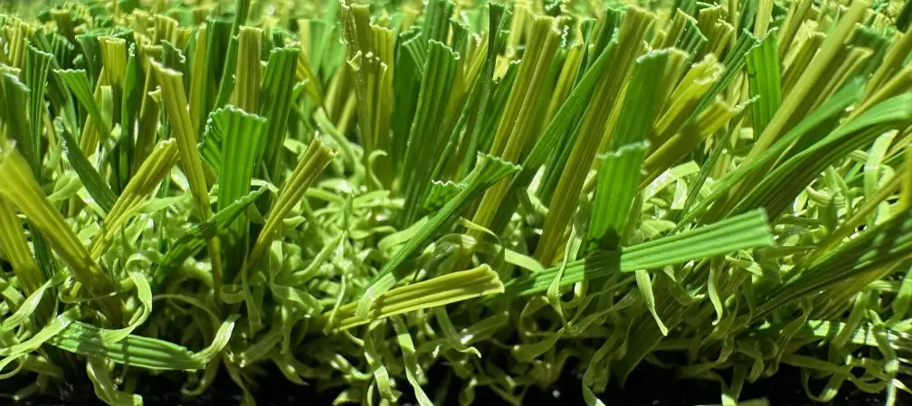 A close-up of Texas Tuff's Alamo Plus turf grass, a rugged artificial grass solution for DFW featuring a 1 ¼” pile height, a 97-ounce total weight, and excellent drainage.