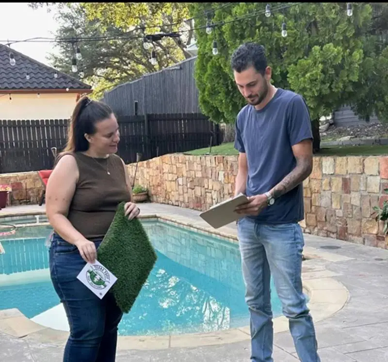 Consultation on artificial turf installation with Texas Tuff team.