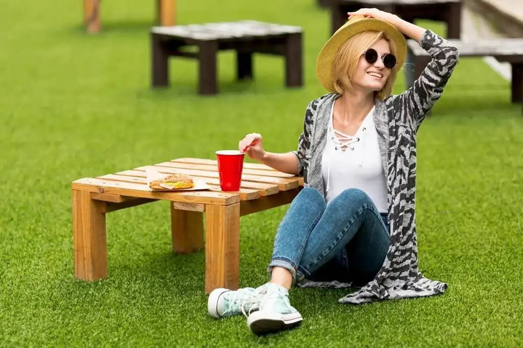 dfw woman enjoying texas ruff artificial grass
